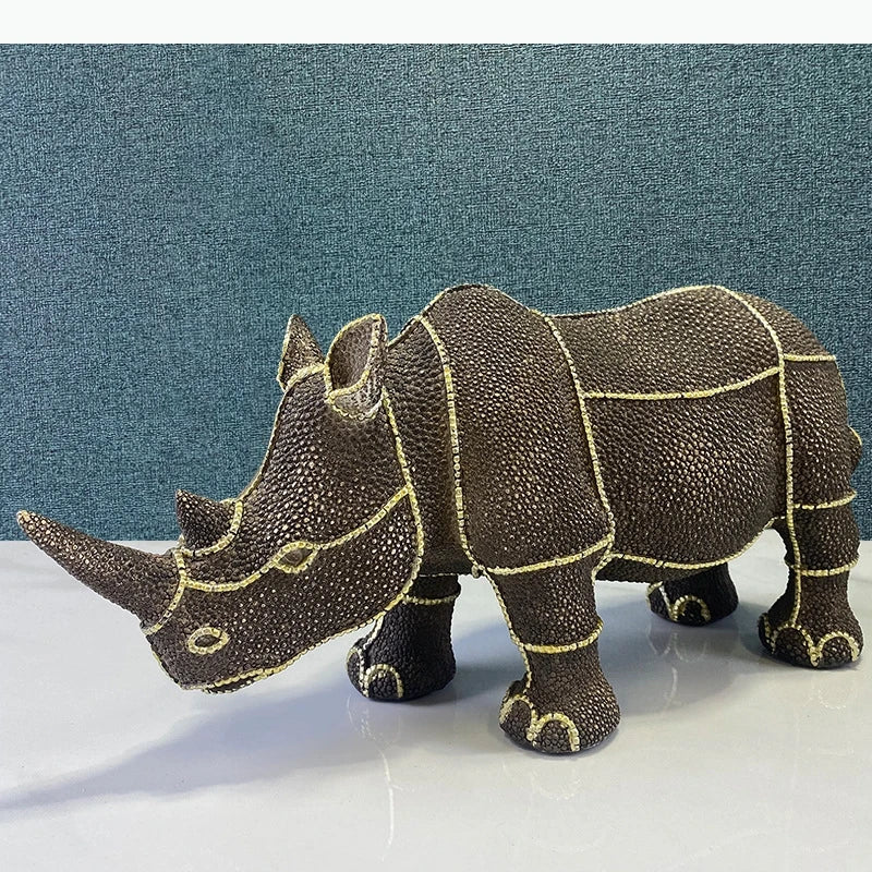 statuette rhinocéros marron foncé texture granuleuse décoratif animalier doré grande petite