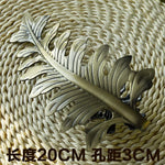 pince rideau feuille stylisée moderne métal fer couleur dorée fixations decorationintérieur anneaux boucles