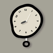 horloge murale original forme irrégulière couleur noir beige chiffres simples salon chambre