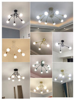 suspension lumineuse moderne noir doré ampoules blanches structure spirale fixation câbles métallique