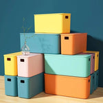 boîtes rangement plastique blanc orange rose vert bleu jaune moderne poignées couvercle