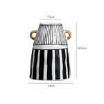 vase céramique rayures noires blanches moderne décoration intérieure arrangement fleurs artificielles minimaliste