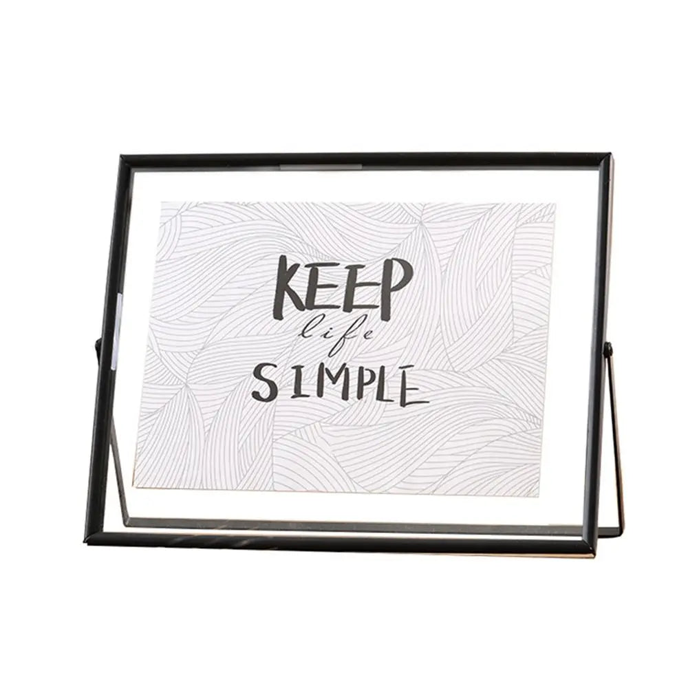 cadre photo moderne minimaliste or noir pieds triangulaires texte simple verre
