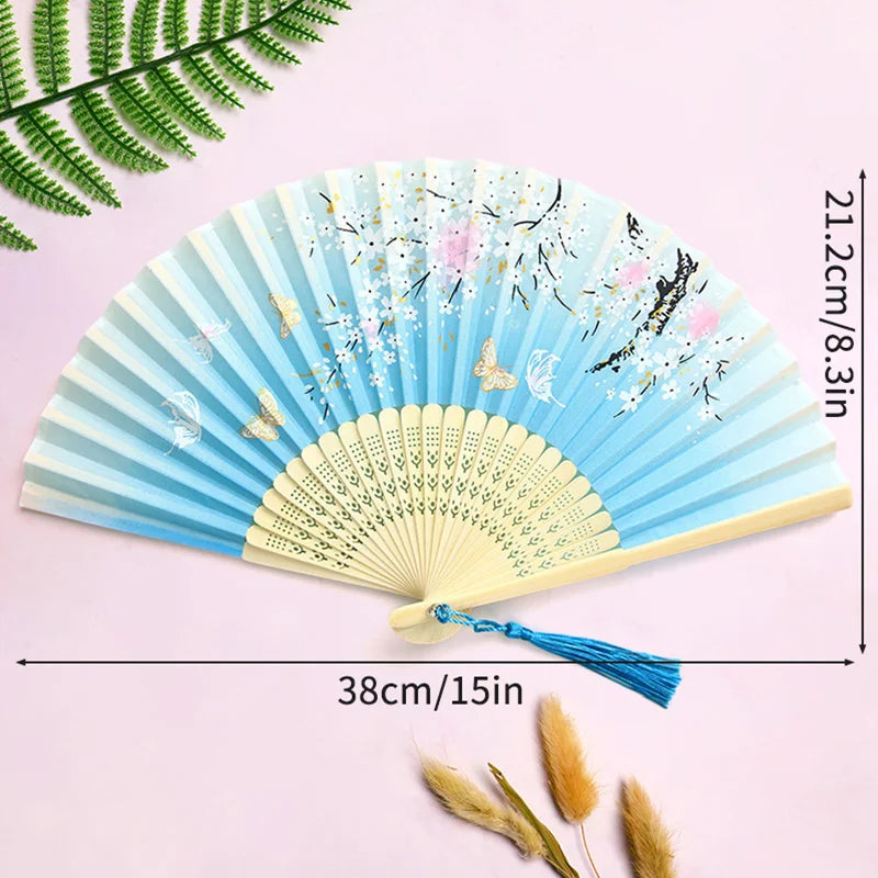 éventail pliant traditionnel bambou motif fleurs cerisier pompon mariage élégant