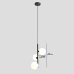 suspension lumineuse moderne sphères translucides barre métallique brillante blanc doré minimaliste chambre salon