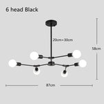 suspension lumineuse moderne or noir sphères translucides scandinave structure métallique pince suspension