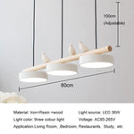 lampe suspendue moderne minimaliste led gris blanc rose jaune bleu oiseaux résine bois