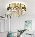lampe moderne or cristal transparent élégante barres dorées inoxydables salon hall