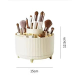 support rangement rotatif blanc rayures modernes pieds dorés pinceaux maquillage fards crèmes ciseaux stylos