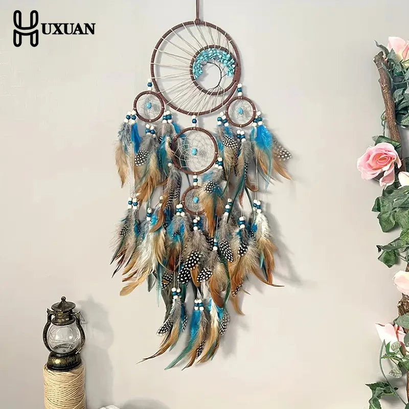 attrape rêves ethnique attrape rêves artisanal plumes bois marron bleu gris blancsuspendu fil