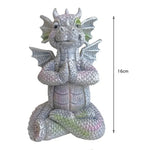 Statue dragon méditation en vert clair sur terrasse