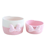 panier rangement rose blanc rayures horizontales noeud décoratif réutilisable polyestère enfantin cordelette organisation jouets