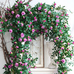guirlande fleurs artificielles roses feuilles vertes extérieur accrochage naturelle rustique