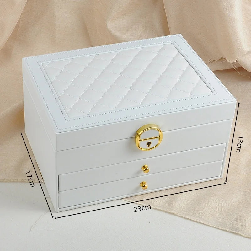 boîte bijoux cuir vert foncé blanc rose pâle motifs géométriques classique chic poignées dorées