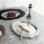 assiettes ovales argentées motifs floraux classiques dessert fruits organisateur table manger