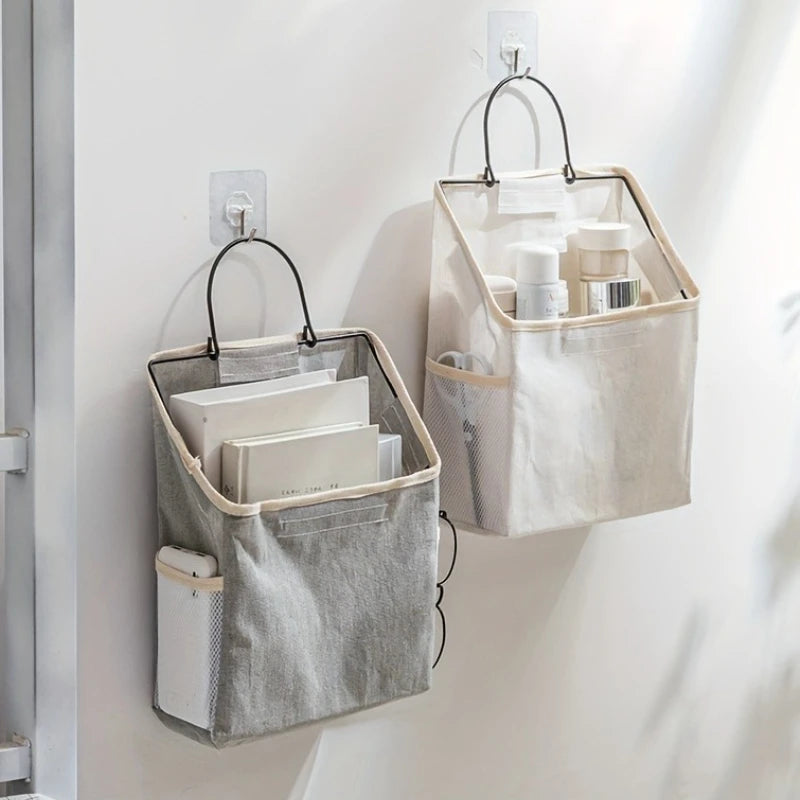 sac rangement mural toile coton beige gris minimaliste poches clips adhésifs poignées métalliques modernes