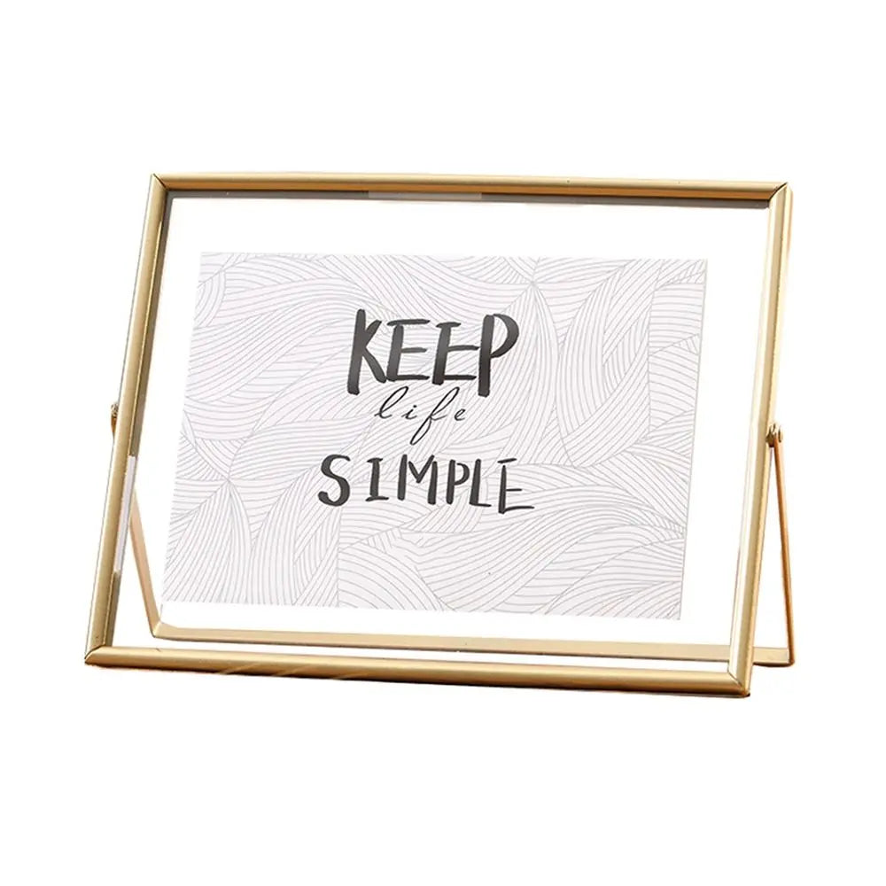 cadre photo moderne minimaliste or noir pieds triangulaires texte simple verre