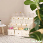 meuble decoratif miniature blanc crème tiroirs transparents objets fantaisie sci fi