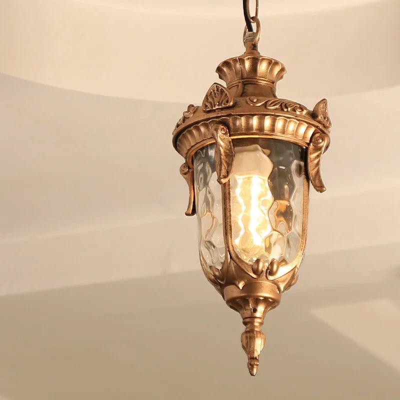 lampe suspendue vintage bronze noir ornements sculptés verre texturé semi opaque chambre salon
