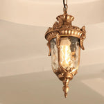 lampe suspendue vintage bronze noir ornements sculptés verre texturé semi opaque chambre salon