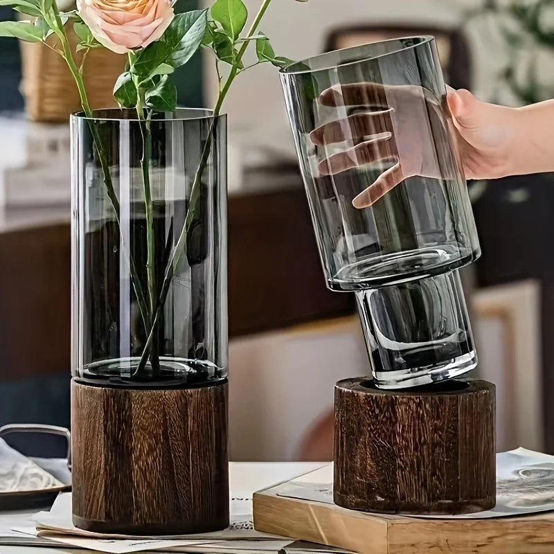vase verre moderne transparent bois base gris fleurs artificielles décoration intérieure table arrangement floral