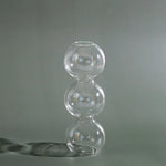 vases verre transparent moderne orange rose sphères empilées décoration maison table fleurs hydroponiques