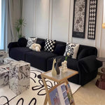 canapé vert olive moderne tissu uni bois coussins décoratifs sectionnel français minimaliste