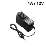 chargeur universel 12v 1a noir prise eu us mat moderne câble 92cm abs certifié