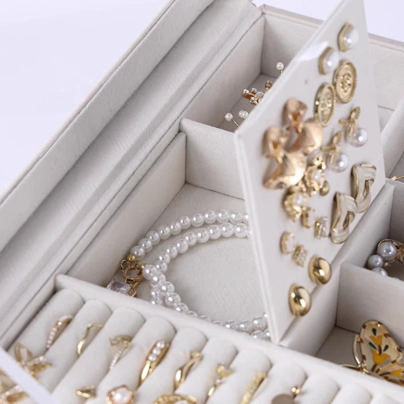 boîte bijoux simili cuir blanc moderne poignées dorées velours intérieur portable 360 degrés rotation