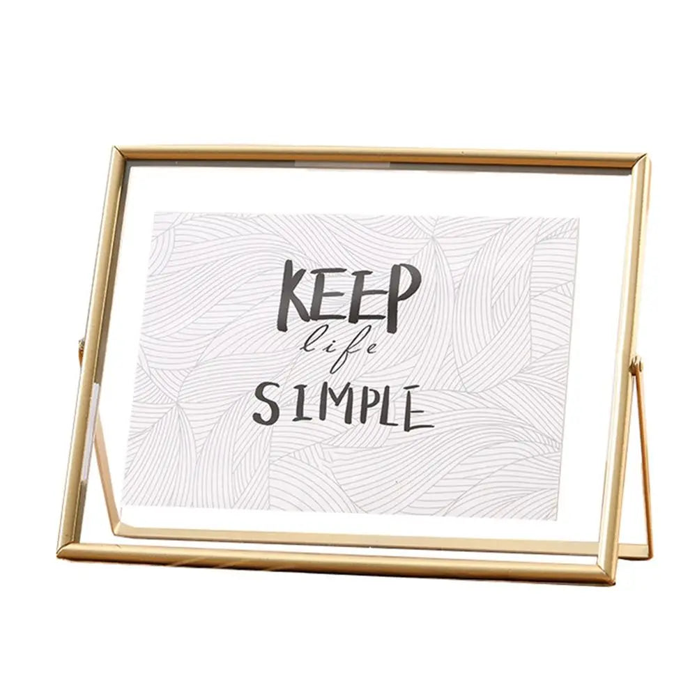 cadre photo moderne minimaliste or noir pieds triangulaires texte simple verre