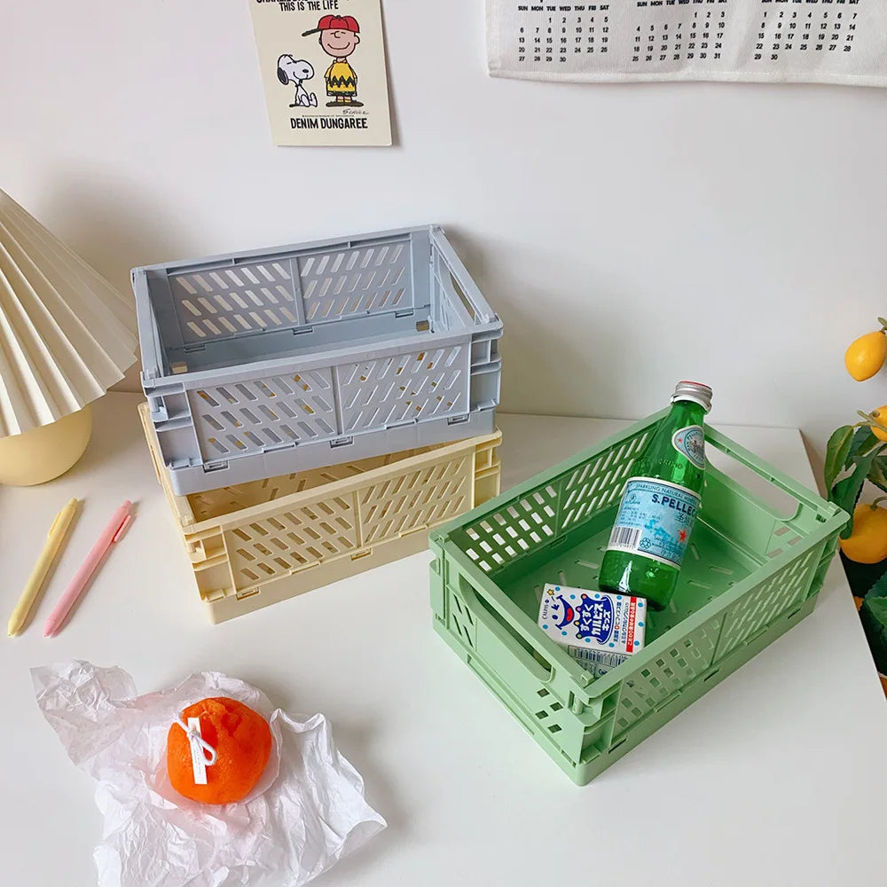 caisse rangement pliable plastique vert beige rose orange violet grille ventilation clips latéraux moderne