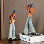 statues musiciens saxophone trompette ethniques motifs floraux bleu marron orange gris