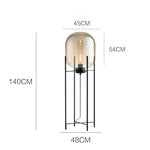 lampe sol moderne transparente ampoule filament noir gris fumé led verre minimaliste