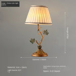 lampe table classique abat jour rayé beige ornement métal doré feuilles vertes interrupteur câble