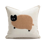 Coussin décoratif blanc moelleux orné d'un motif de chat brun.