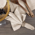 serviettes tissu lin brodé rustique beige feuilles vertes argentées fixations points cousus