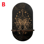 étagère murale noire dorée ornementations astrologiques pendeloques semi précieuses artisanal