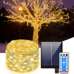 Guirlande lumineuse solaire 20m étanche illuminant un jardin le soir