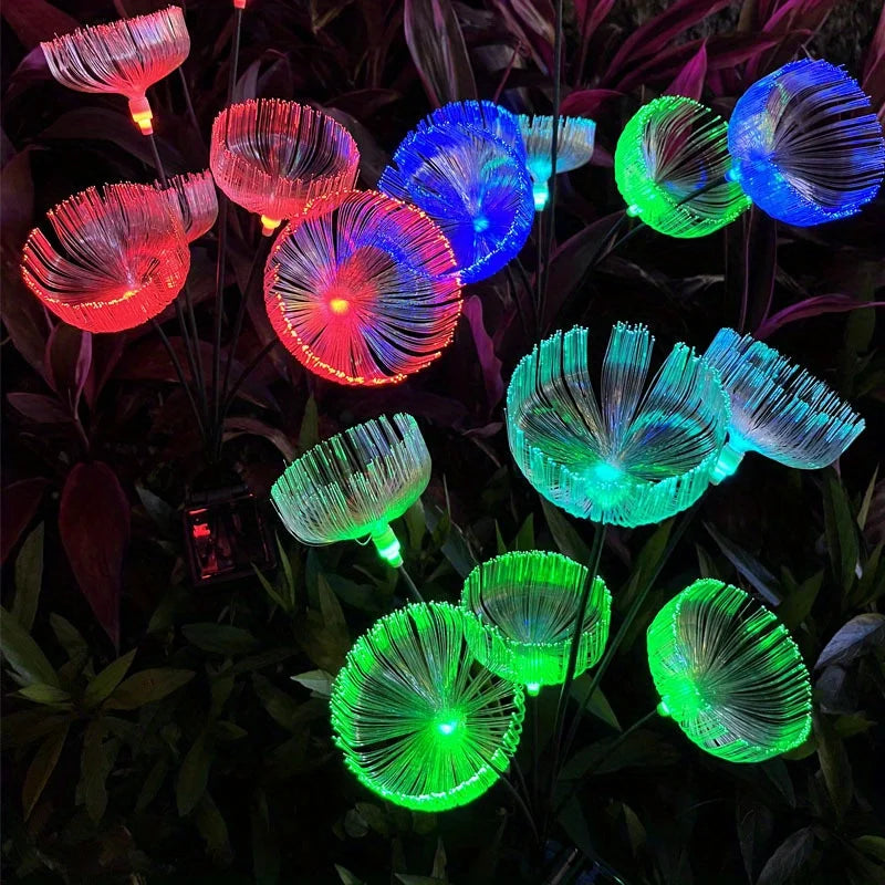 lampe solaire fleur rouge bleu vert transparent fibres lumineuses moderne extérieur ambiance