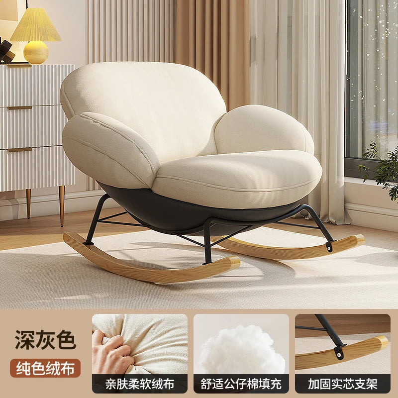 fauteuil bascule moderne beige noir orange roulettes coussin repos minimaliste salon