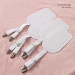 attaches drap réglables sangles élastiques clips métalliques plaques blanches modernes minimalistes