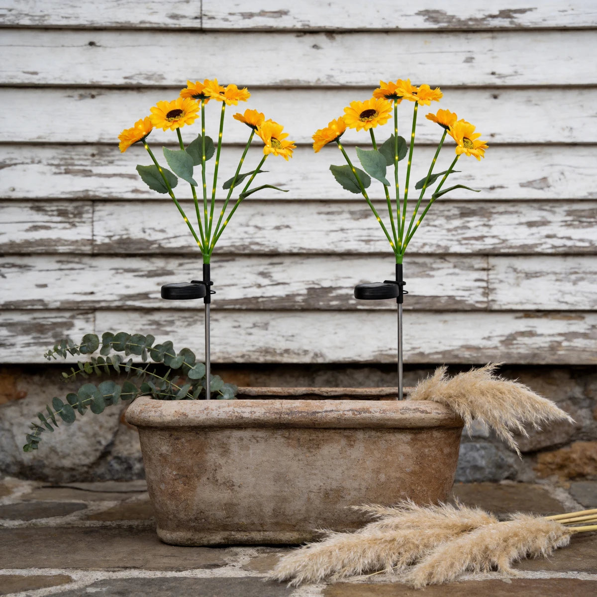 décoration extérieure solaire moderne bouquet lumineux jaune vert tringle métallique fleurs feuilles paysagère