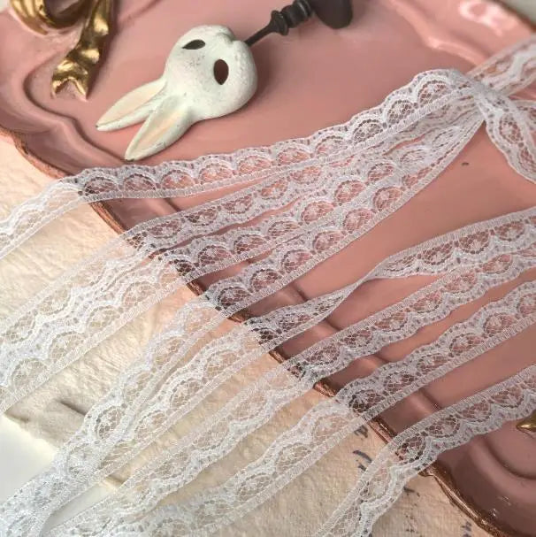 ruban dentelle brodée 10mètres blanc motifs floraux classique polyester soluble eau