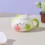 théière chat forme visage mignon vert blanc rose couvercle cartoon