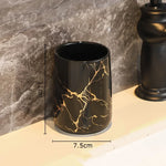 ensemble porte brosse dents porte savon marbre moderne or noir élégant bouteille parfum fleurs