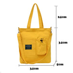 sac main uni jaune blanc vert noir moderne poignées détachables porte clés poche avant