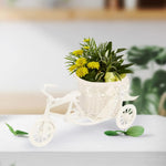 Mini vélo fleuri violet en déco salon