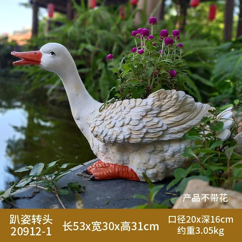 statue canard blanc plumes orange piscine jardin décoration extérieure animaux ornements paysagistes fleurs artificielles