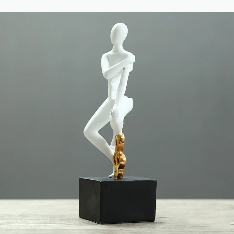 statues décoratives minimalistes figures humaines stylisées blanc noir élément doré moderne abstrait