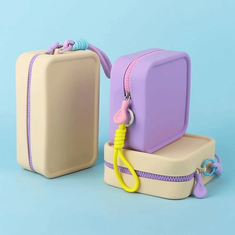 boîte rangement silicone pliable multi usages respectueux environnement moderne cordon ajustable beige violet rose